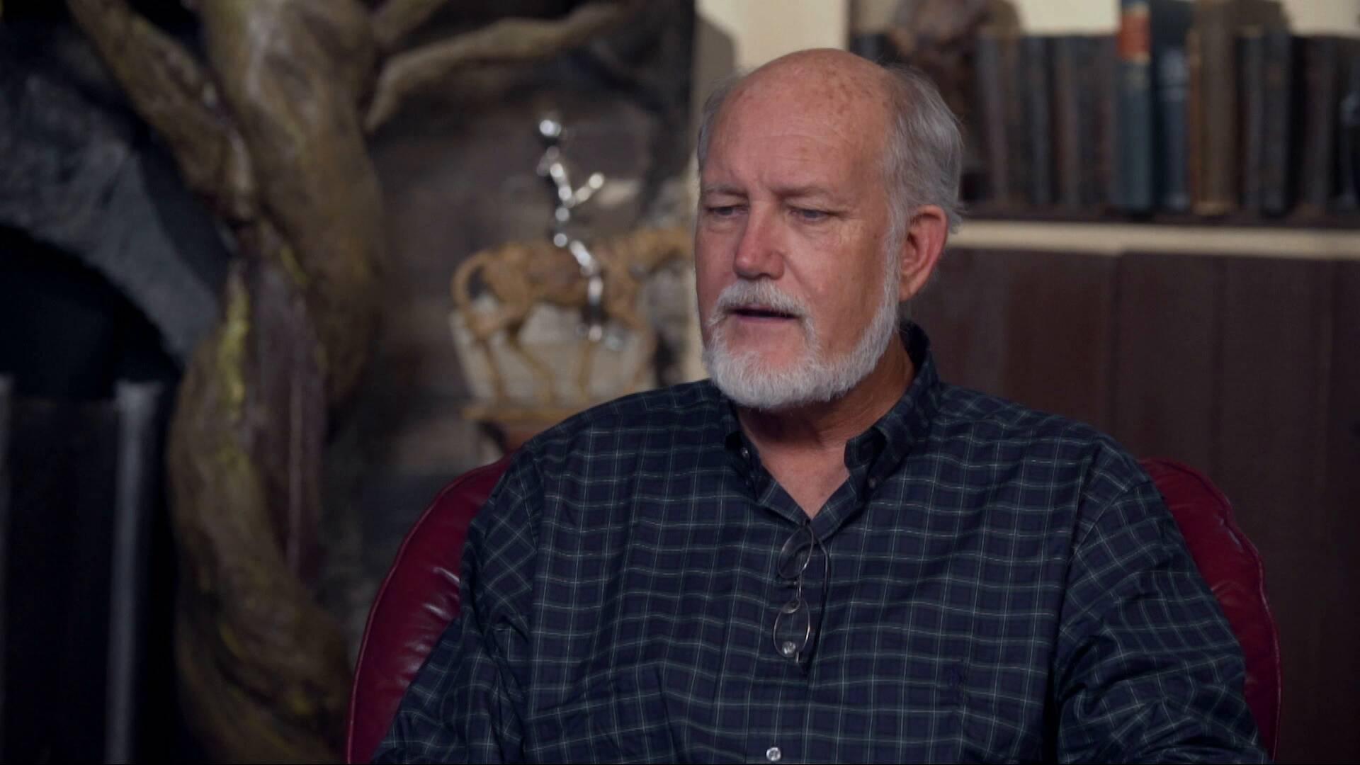 Roy Williams speaking from leather chair in studio August 2019