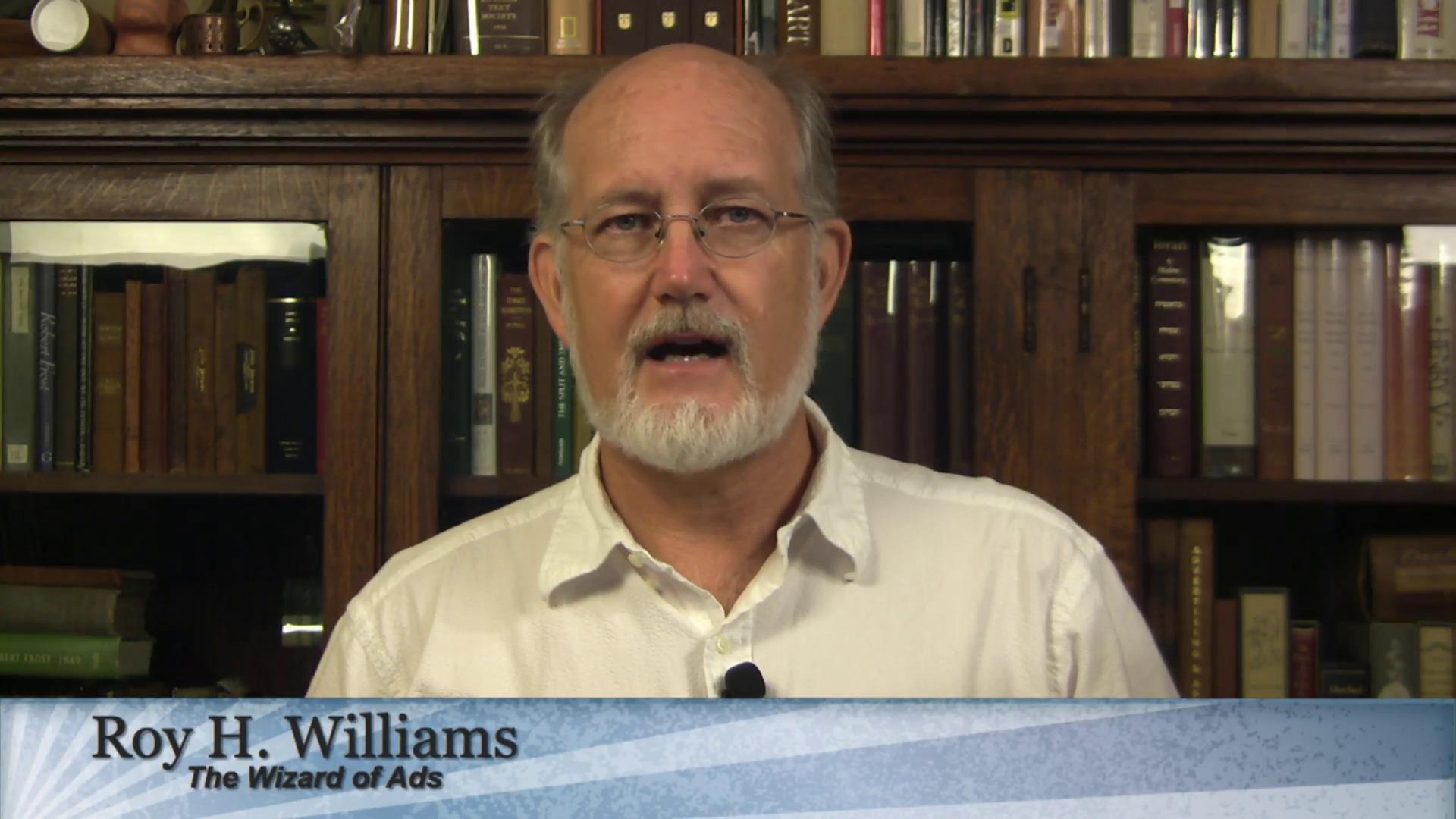 Roy Williams speaking in front of bookcase September 2015