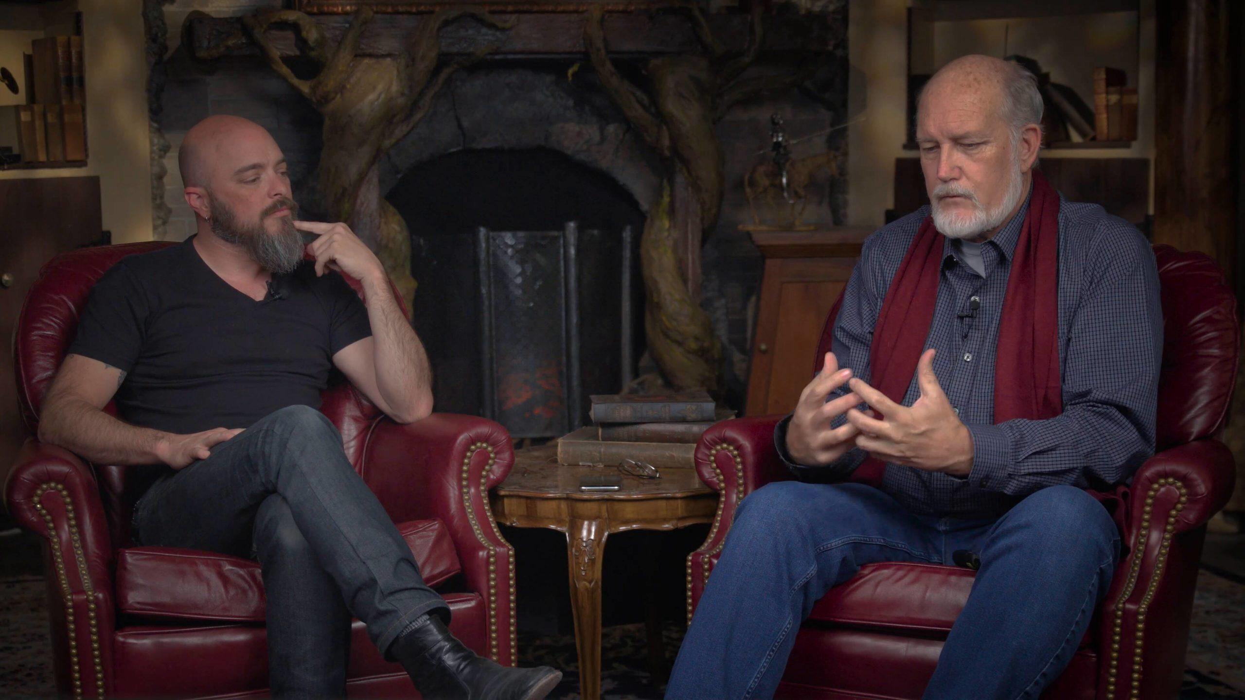 Daniel Whittington and Roy Williams sitting in leather chairs near fireplace, January 2020